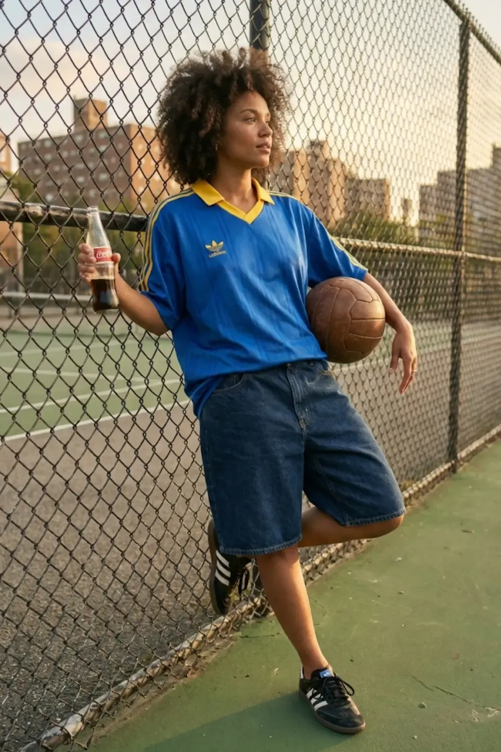 A woman rocking the 'Blokecore' aesthetic, blending retro sportswear with casual street style.