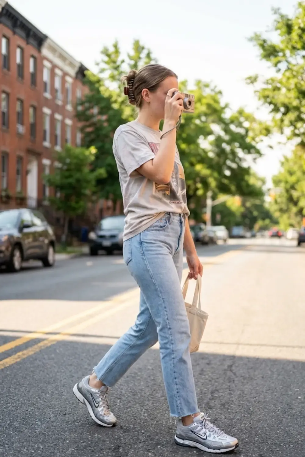 A woman with a nostalgic, late-90s/early-2000s street aesthetic with Nike P-6000